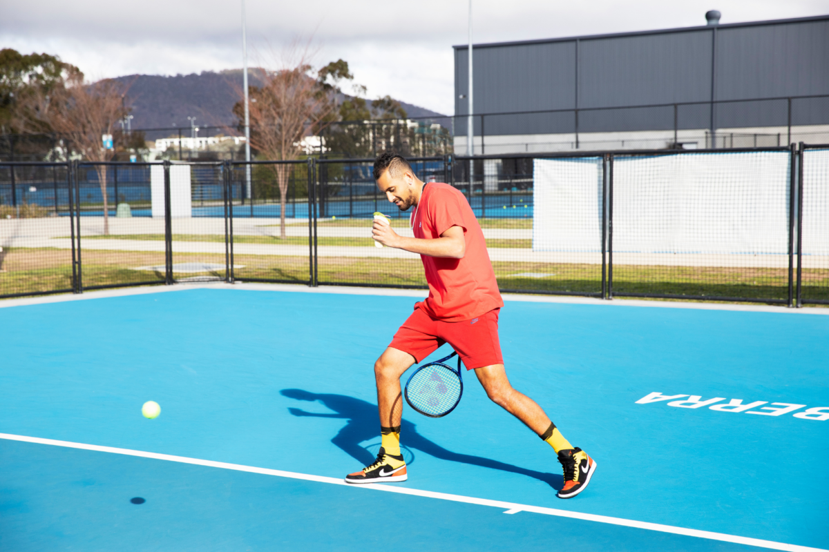 Nick Kyrgios trick shot while holding tortilla pocket