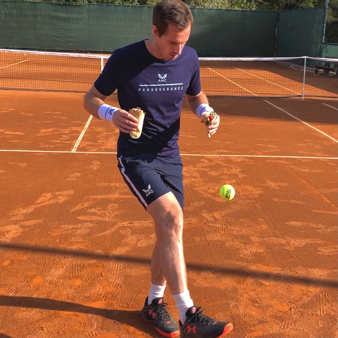 Tennis player bouncing ball on foot while holding tortilla pocket